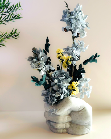 Eternal Flowers in Concrete Fist Vase by artist Aileen Warren